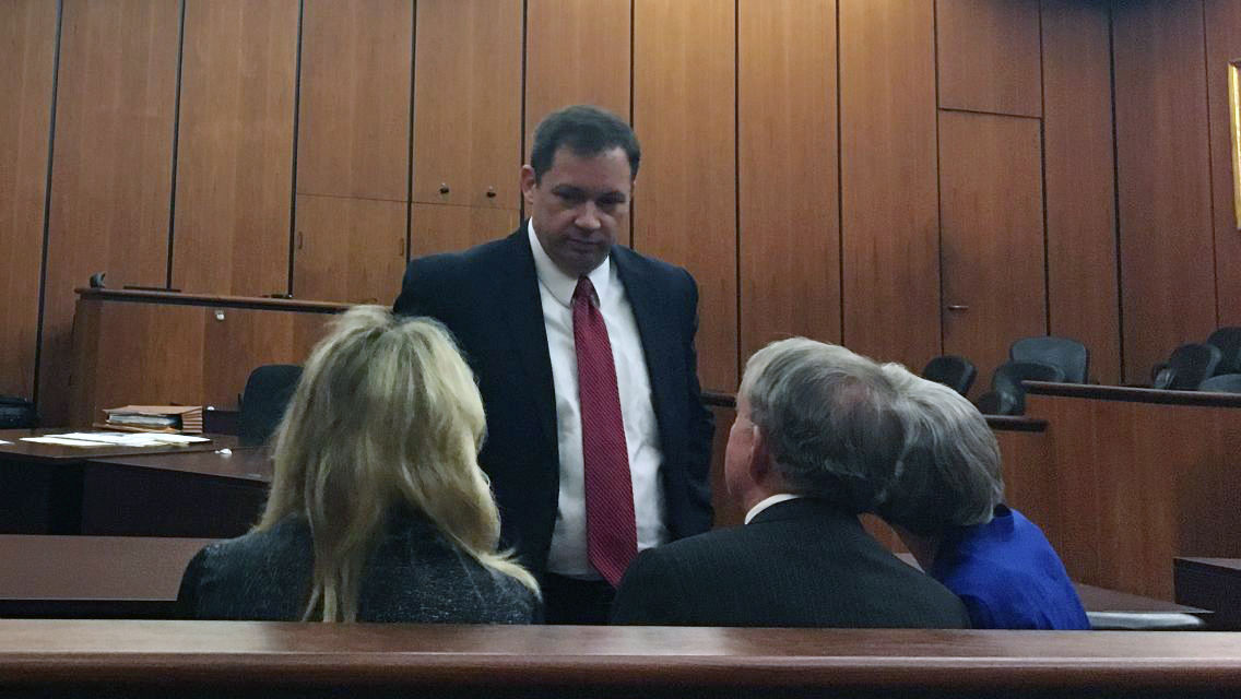 Prosecutor David Pascoe addresses Sen. John Courson